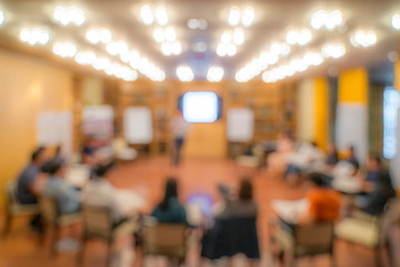 blurry asian people sit in round for meeting and share experience.
