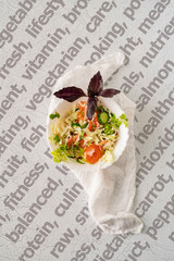 Wall Mural - detox salsad in a white ceramic bowl with cabbage, tomaso and basil isolated