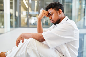 Wall Mural - Exhausted doctor with burnout due to overtime