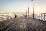 Fototapeta Pomosty - wooden pier at sunset 