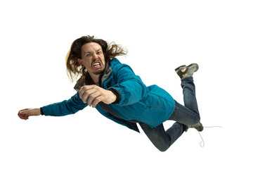 A second before falling. Caucasian young man falling down in moment with bright emotions and facial expression. Male model in casual clothes on white. Shocked, scared, screaming. Copyspace for ad.