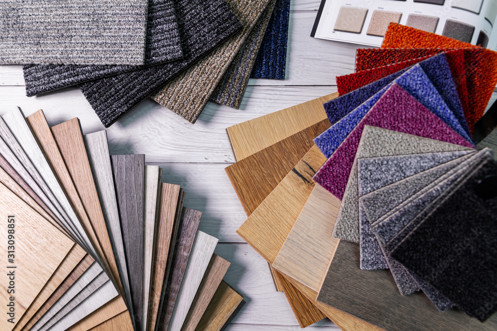 flooring and furniture materials - colorful floor carpet and wooden laminate samples - obrazy, fototapety, plakaty 