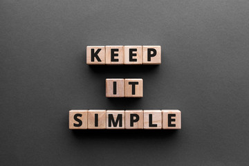 keep it simple - word from wooden blocks with letters, to make something easy, keep it simple concep