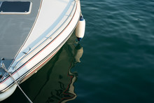 A Fragment Of The Bow Of A Motor Boat With A Mooring Shock Absorber Suspended From The Side. Copy Space.