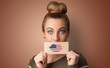 © ra2 studio - Person holding USA flag lips shape card