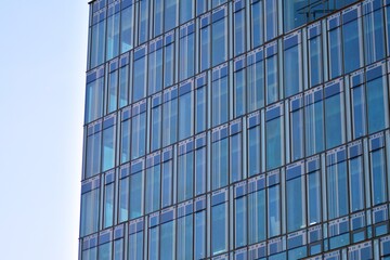 The windows of a modern building for offices. Business buildings architecture.