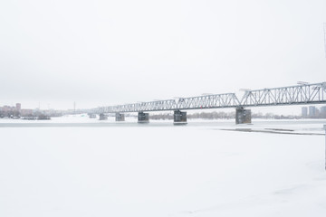  A  travels  bridge over a snow river in winter