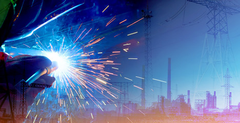 Double exposure of production and welding process. Modern technologies for the comfortable life of mankind and the industrial revolution
