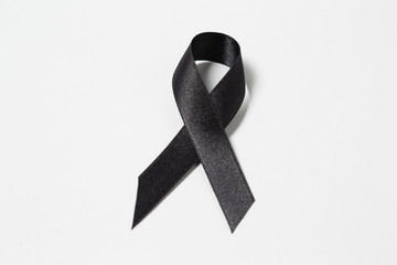 A black awareness ribbon isolated on white background