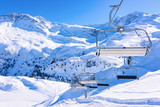Chair lifts in Hintertux Glacier ski resort in Tyrol in Mayrhofen in Zillertal valley in Austria in winter Alps. Cable cars in Hintertuxer Gletscher in Alpine mountains with white snow and blue sky.