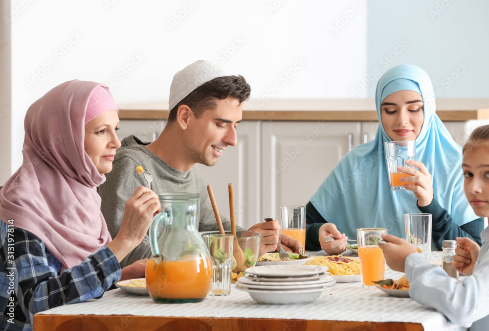 Muslim family having dinner at home