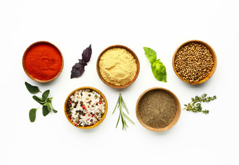 Many different spices on white background