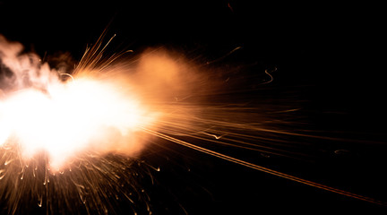 Wall Mural - the texture of a shot from a firearm on a black background, the output of gunpowder gases from the barrel of a rifle and a pistol