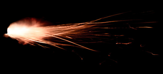 Wall Mural - the texture of a shot from a firearm on a black background, the output of gunpowder gases from the barrel of a rifle and a pistol