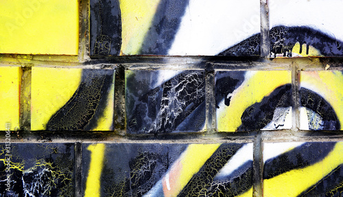 White brick wall painted with acrylic multicolored paint for background