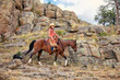 Cowgirl Riding on Rocks