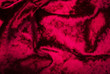 Abstract red purple creasy velvet fabric background texture. beautiful luxurious fabric for draperies, curtains, bed cover, love Valentine day backdrop.