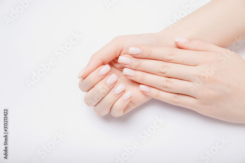 Stylish trendy nail young woman hands pink manicure on white background Fototapet