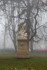 Canvas Print - KRAKOW, POLAND - OCTOBER 17, 2019: Monument of literature heroes in misty, autumn park