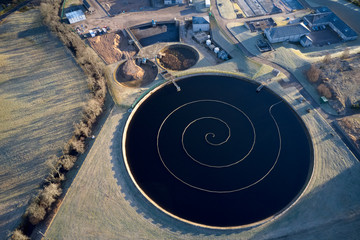 Sewage water works treatment plant aerial view from above showing waste quality round circular control tank
