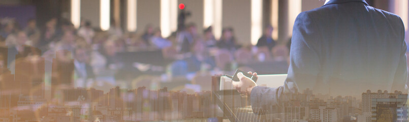 seminar presenter at corporate conference giving speech. speaker giving lecture to business audience