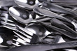 Pile of old scratched and dull flatware in need of polishing