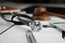 Medical Law Concept. Gavel, Notebook And Stethoscope On The White Table. Place For Text.