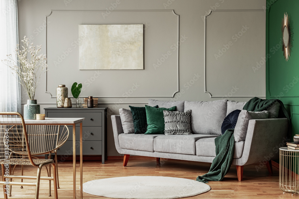 Stylish emerald green and grey living room interior design with abstract painting on the wall - obrazy, fototapety, plakaty 