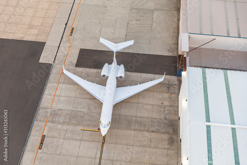 Cuadros en Lienzo White unbranded private jet Plane waiting in runway