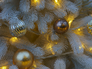 Wall Mural - Photography of decoration of  artificial Christmas tree. Bright balls in focus. Concepts of holidays, New Year's Eve, good mood and vacations.