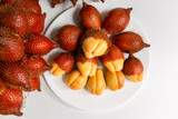Salak fruit, Salacca zalacca in dish on the table. Asian fruit.