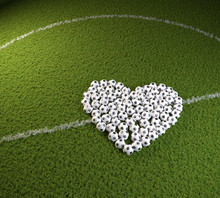 3D Render: Valentines Day For Soccer Fans - A Heart Shape Of Soccers Balls On A Soccer Field. Can Be Used Horizontally And Vertically After Cropping.