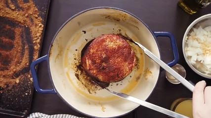 Sticker - Time lapse. Flat lay. Step by step. Cooking boneless pork roast in cast iron dutch oven.