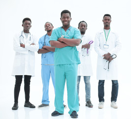 Wall Mural - smiling surgeon standing in front of his colleagues