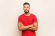 © Asier - Young south-asian man who feels confident, crossing arms with determination.