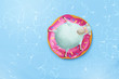Cartoon sheep on big pink inflatable donut taking a sunbath in swimming pool. Positive vacation illustration