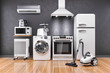 Set of home kitchen appliances in the room on the wall background