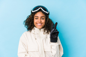 Young african american skier woman isolated showing number two with fingers.