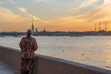 Saint-Petersburg, Russia June 18 2019, A man fishing on promenade, at  sunny day. Without visible face.