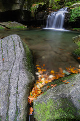 Wall Mural - Autumn waterfalls with stones