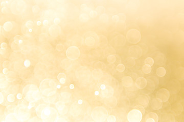 abstract gold background with soft blur bokeh light effect, background bokeh