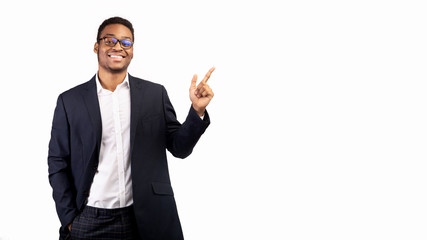 African guy pointing at free space with index finger