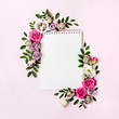 Leinwandbild Motiv Notepad and floral frame in pastel colors. Happy easter concept. Roses, leaves and quail eggs around blank clean sheet