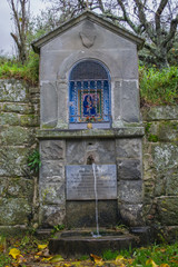 Wall Mural - icon over the well near the church