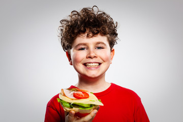 Wall Mural - Boy eating big sandwich