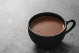 simple cup of hot cocoa drink on terrazzo background