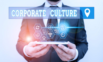 Writing note showing Corporate Culture. Business concept for beliefs and attitudes that characterize a company