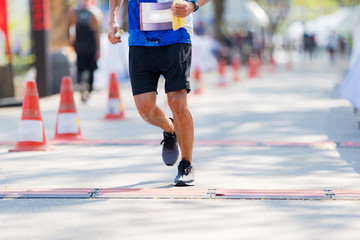 People feet, Marathon running in streets of the park