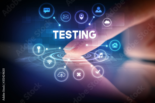 Fotomural Finger touching tablet with web technology icons and TESTING inscription, web te