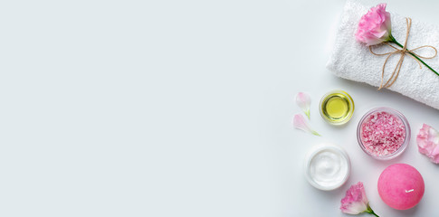 Wall Mural - facial cream and pink salt with flower petals, fresh pink rose
